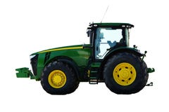 Agricultural machinery tractor. Powerful motor vehicle with large rear wheels, used chiefly on farms for hauling equipment and trailers. Isolated, white royalty free stock photo Agricultural machinery tractor. Powerful motor vehicle with large rear wheels, used chiefly on farms for hauling equipment and trailers. Isolated, white royalty free stock photo