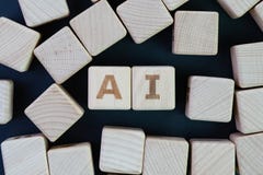AI, Artificial Intelligence or machine learning in future world concept, straggle cube wooden blocks with some combine the word AI