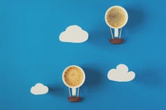 Air Balloon From Cups Of Espresso With Paper Clouds. Royalty Free Stock Photography Air Balloon From Cups Of Espresso With Paper Clouds. Royalty Free Stock Photography