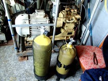 Compressor filling scuba tanks with high pressure air stock photography Compressor filling scuba tanks with high pressure air stock photography