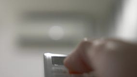 Air Conditioning Is A Wireless Remote Control In The Hands