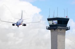 Air traffic control tower with jet airplane