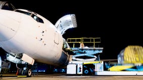 Aircraft loading cargo time lapse in night