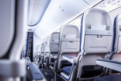 Airplane Seats In Cabin. Commercial Aircraft Cabin With Rows Of Seats Down The Aisle. Economy Class. Stock Photography