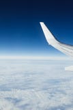 Airplane wing, clouds and blue sky Stock Photography Airplane wing, clouds and blue sky Stock Photography