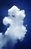Airplane With The Background Of Clouds And Blue Sky Stock Images