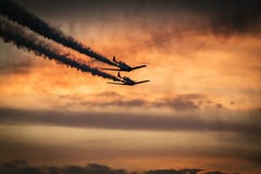 Airplanes in sky with smoke trails Airplanes in sky with smoke trails