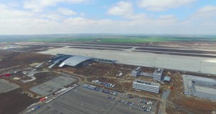 Airport and surrounding area. An aerial view of the airport hangers and surrounding area. High level aerial view of the stock video Airport and surrounding area. An aerial view of the airport hangers and surrounding area. High level aerial view of the stock video