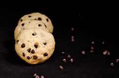 Homemade cookies with chocolate drops filling on a black background royalty free stock image Homemade cookies with chocolate drops filling on a black background royalty free stock image