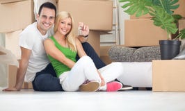 Ajouter heureux à la clé de la nouvelle maison photo stock Ajouter heureux à la clé de la nouvelle maison photo stock