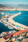 Alanya port surrounded by mountains. Seaside landscape. Lighthouse and boats. Touristic place Royalty Free Stock Image Alanya port surrounded by mountains. Seaside landscape. Lighthouse and boats. Touristic place Royalty Free Stock Image