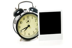 Alarm Clock And Polaroid Frame Royalty Free Stock Photos