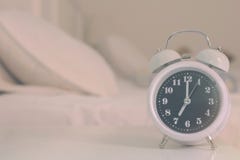 Alarm Clock On The Bed In Bedroom, Retro Style Stock Photography
