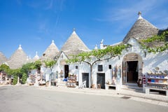 Alberobello, Apulia - JUNE 1, 2017 - A street with souvenir shop stock photo Alberobello, Apulia - JUNE 1, 2017 - A street with souvenir shop stock photo