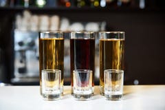 Alcohol shots and empty stemware stock photography Alcohol shots and empty stemware stock photography
