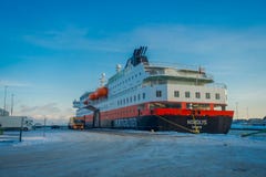 ALESUND, NORWAY - APRIL 04, 2018: Outdoor view of Hurtigruten coastal vessel KONG HARALD, is a daily passenger and stock images ALESUND, NORWAY - APRIL 04, 2018: Outdoor view of Hurtigruten coastal vessel KONG HARALD, is a daily passenger and stock images