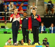 All-around gymnastics winners at Rio 2016 Olympic Games Aliya Mustafina L, Simone Biles and Aly Raisman during medal ceremony stock photos All-around gymnastics winners at Rio 2016 Olympic Games Aliya Mustafina L, Simone Biles and Aly Raisman during medal ceremony stock photos