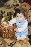 Little girl rejoices at the festive basket stock photography Little girl rejoices at the festive basket stock photography
