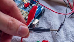 Alligator clips used in mirocontroller builds to temporarily connect components royalty free stock photo Alligator clips used in mirocontroller builds to temporarily connect components royalty free stock photo