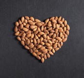 Almond nuts in heart shape Stock Photo Almond nuts in heart shape Stock Photo