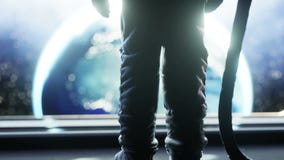 Alone astronaut in futuristic space corridor, room. view of the earth. cinematic 4k footage.