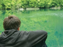 Alone meditate boy and river stock photography Alone meditate boy and river stock photography