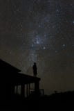 Alone woman on rooftop watching mliky way and stars in the night sky on Bali island royalty free stock image Alone woman on rooftop watching mliky way and stars in the night sky on Bali island royalty free stock image