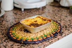 Aluminum tray with cooked lasagna on table royalty free stock photo Aluminum tray with cooked lasagna on table royalty free stock photo