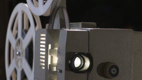 Amateur cinema. Projector for 8mm film. 1960s, 1970s, 1980s years. Home cinema. Film super 8. Footage clip 4k