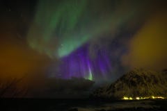 Amazing multicolored Aurora Borealis also know as Northern Lights in the night sky over Lofoten landscape, Norway, Scandinavia.
