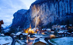Amazing Touristic Alpine Village At Night In Winter With Famous Church And Staubbach Waterfall Lauterbrunnen Switzerland Europe Stock Images Amazing Touristic Alpine Village At Night In Winter With Famous Church And Staubbach Waterfall Lauterbrunnen Switzerland Europe Stock Images