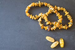 Amber. Beads from amber. Amber necklace on stone background stock images Amber. Beads from amber. Amber necklace on stone background stock images
