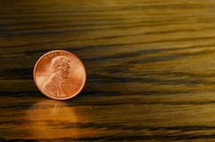 Cent copper coin on wooden background Stock Photos Cent copper coin on wooden background Stock Photos