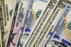 American dollars cash money. background from US dollars. different banknotes stock photo American dollars cash money. background from US dollars. different banknotes stock photo