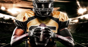 American football sportsman player on stadium. Sport wallpaper. royalty free stock photography American football sportsman player on stadium. Sport wallpaper. royalty free stock photography