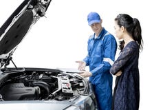 American mechanic showing report on studio Royalty Free Stock Photos American mechanic showing report on studio Royalty Free Stock Photos
