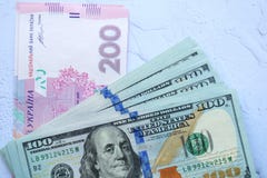 American one hundred dollars banknotes and Ukrainian 200 hryvnia, money background royalty free stock image American one hundred dollars banknotes and Ukrainian 200 hryvnia, money background royalty free stock image