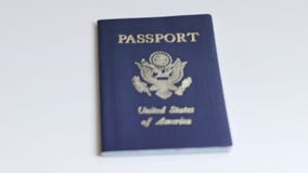 American / US passport placed on a white table