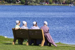 Amish girls sitting by the lake royalty free stock photos Amish girls sitting by the lake royalty free stock photos