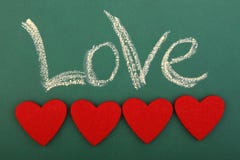 Amour de tableau noir avec quatre coeurs Photos stock