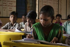 AMRAVATI, MAHARASHTRA, INDIA, August 2018, Girl writing at her desk at primary school at Ghuti Village, Dharni Taluka