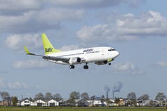Amsterdam Airport Schiphol - Boeing 737 Of Air Baltic Lands Royalty Free Stock Images Amsterdam Airport Schiphol - Boeing 737 Of Air Baltic Lands Royalty Free Stock Images