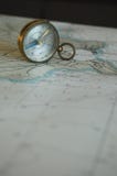 An Old Compass And A Map Stock Images