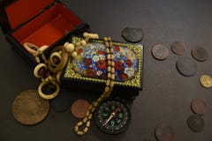Ancient coins, casket, beads and compass. stock photography Ancient coins, casket, beads and compass. stock photography