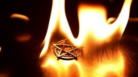 Ancient pentagram burning slow motion from 120fps