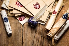 Ancient scrolls and old envelope with blue inkwell stock photos Ancient scrolls and old envelope with blue inkwell stock photos