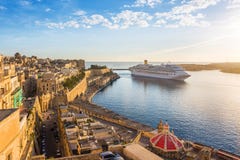 The ancient walls of Valletta and Malta harbor with cruise ship in the morning - Malta royalty free stock photos The ancient walls of Valletta and Malta harbor with cruise ship in the morning - Malta royalty free stock photos