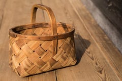 Ancient wicker basket on a wooden background. Selective focus. Free space for text. royalty free stock photo Ancient wicker basket on a wooden background. Selective focus. Free space for text. royalty free stock photo