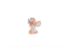 Ange gardien de figurine de porcelaine jouant la trompette image stock Ange gardien de figurine de porcelaine jouant la trompette image stock