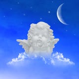 Angel on clouds in the night sky stock photography Angel on clouds in the night sky stock photography